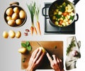 Cooking in the Kitchen. Preparing a Dish with a Fresh Vegetables. A man prepares a lunch or dinner meal Royalty Free Stock Photo
