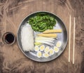 Cooking Korean food, glass noodles, chuka seaweed, boiled quail eggs, ginger, corn pan and chopsticks