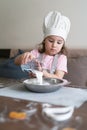 Cooking little girl with milk Royalty Free Stock Photo
