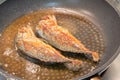 Cooking mackerel fish in the pan Royalty Free Stock Photo
