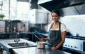 Cooking, making food and working as a chef in a commercial kitchen with tongs and industrial equipment. Portrait of a Royalty Free Stock Photo