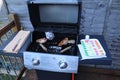 Cooking meat outdoors on a gas flamed bbq