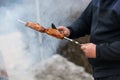 Cooking meat skewers on skewers on the grill Royalty Free Stock Photo