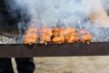 Cooking meat skewers on skewers on the grill Royalty Free Stock Photo