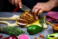 Cooking meat steak, vegetables and spices with by chef hands on wooden background. Food recipe concept Royalty Free Stock Photo