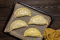 Cooking meat turnovers or pies, or empanadas, or cornish pasty. Unbaked