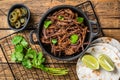 Cooking of mexican pork carnitas taco. Wooden background. Top view Royalty Free Stock Photo