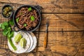Cooking of mexican pork carnitas taco. Wooden background. Top view. Copy space Royalty Free Stock Photo