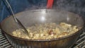 Cooking migas or Crumbs a typical spanish food. Crumbs prepared in a frying pan