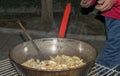 Cooking migas or Crumbs a typical spanish food. Crumbs prepared in a frying pan