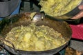 Cooking migas or Crumbs a typical spanish food. Crumbs prepared in a frying pan