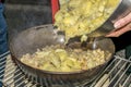 Cooking migas or Crumbs a typical spanish food. Crumbs prepared in a frying pan