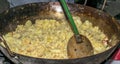 Cooking migas or Crumbs a typical spanish food. Crumbs prepared in a frying pan
