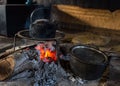 Cooking in the nature. Cauldron on fire in forest Royalty Free Stock Photo