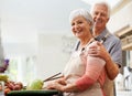 Cooking, nutrition and portrait of old couple in kitchen for salad, love and health. Happy, smile and retirement with Royalty Free Stock Photo