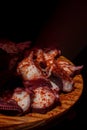 Cooking octopus tentacles, according to the traditional Galician recipe of pulpo a feira. Pulpo a la gallega. Spain.