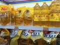 Cooking oil in packages and bottles in a minimarket window