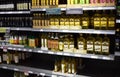 A cooking oil section in a British supermarket with a sign advising each customer can only buy 2 items