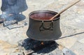 Cooking.old couldron on fire Royalty Free Stock Photo