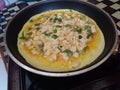 cooking an omelet in a frying pan Royalty Free Stock Photo