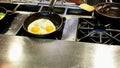 Cooking omelettes and fried eggs. Breakfast buffet in restaurant Royalty Free Stock Photo