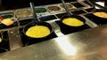 Cooking omelettes and fried eggs. Breakfast buffet in restaurant Royalty Free Stock Photo