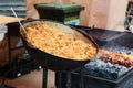 Cooking oroginal Uzbek pilaf in big wok. Preparation of pilaf. Street food Royalty Free Stock Photo