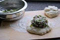 Cooking Ossetian pies with beet tops and cheese, second step