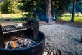 Cooking over Open Grill while Camping in the Wilderness