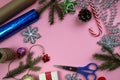 Christmas preparation for gift wrapping on a pink background