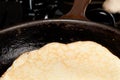 Cooking pancake mix into frying pan Royalty Free Stock Photo