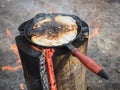 Cooking pancakes on a finnish candle. Maslenitsa holiday