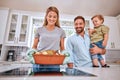 Cooking, parents and child happy with meal for dinner in the kitchen of their house. Turkey, thanksgiving and mother and Royalty Free Stock Photo