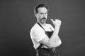 Cooking is passion. Cook with beard and mustache wear apron red background. Man mature cook posing cooking apron. Fine