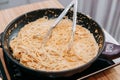 Cooking pasta with seafood in a cooking class. Italian pasta with seafood. Mussels, squid, shrimp Royalty Free Stock Photo