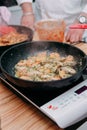 Cooking pasta with seafood in a cooking class. Italian pasta with seafood. Mussels, squid, shrimp Royalty Free Stock Photo