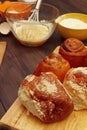 Cooking pastries from natural ingredients to fresh buns on rustic wooden table