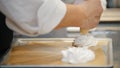 Cooking Pavlova Dessert meringue - pastry tube spread meringue on a baking sheet Royalty Free Stock Photo