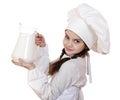 Cooking and people concept - Little girl in a white apron holdin
