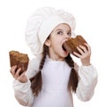 Cooking and people concept - smiling little girl in cook hat Royalty Free Stock Photo