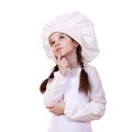 Cooking and people concept - smiling little girl in cook hat