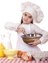 Cooking and people concept - smiling little girl in cook hat Royalty Free Stock Photo