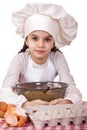 Cooking and people concept - smiling little girl in cook hat Royalty Free Stock Photo