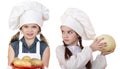 Cooking and people concept - Two Little girls in a white apron