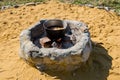 Cooking pilaf in a large cauldron over an open fire Royalty Free Stock Photo