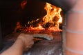 Cooking pizza. Cook prepares calzone in professional open fire oven. Italian cuisine Royalty Free Stock Photo