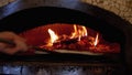 Cooking Pizza in an Italian Woodfired Clay Oven in a Restaurant