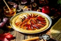 Cooking plum apple pie. Raw pie. Dough. Recipes. Vegetarian food. Dark photo