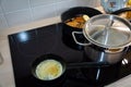 Cooking pork chop, asparagus and melted butter for sunday lunch