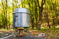 Cooking on a portable gas burner in outdoor conditions hikes Royalty Free Stock Photo